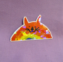 Kissasateenkaari-tarra